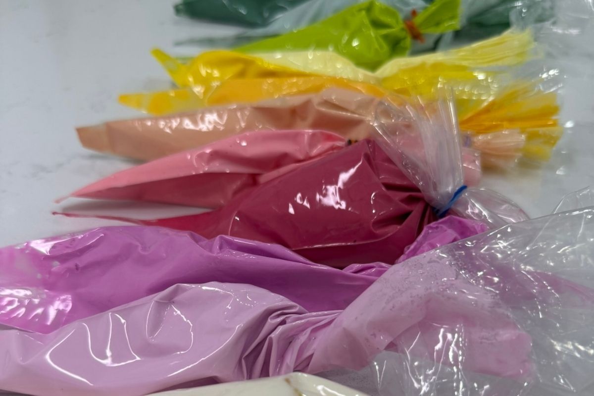 textured modeling paste in piping bags in rainbow colors
